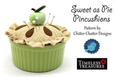 a green cupcake with an apple on top and the words sweet as pie pincusions written below it