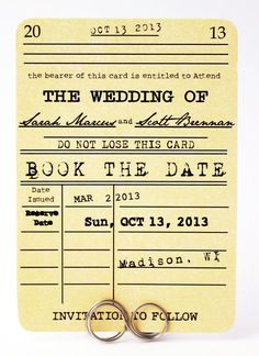 an image of a wedding card with two rings on it