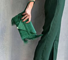 "Small Medusa Clutch in emerald green. An adorable leather clutch with fringes for beautiful fashion looks. This envelope clutch is ideal to carry your essentials! A handmade wrislet from Italian genuine suede leather in emerald colour and silk fringes. The interior is fully lined with beige leatherette. It closes with one metal rivet stud in silver or gold. The pictures show the clutch with gold stud. The clutch comes with a removable wrist strap made from the same leather. Dimensions: Height 1 Green Leather Clutch For Evening, Green Leather Evening Clutch, Leather Party Bags With Tassels, Chic Rectangular Clutch With Fringe, Chic Rectangular Fringe Clutch, Formal Fringe Rectangular Clutch, Chic Clutch With Tassels, Chic Green Leather Clutch, Formal Clutch With Tassels