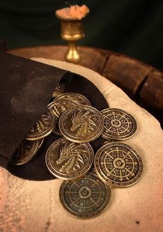 a pile of coins sitting on top of a cushion