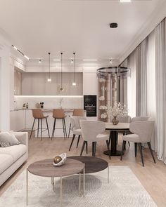 a living room filled with furniture next to a kitchen and dining area in the background