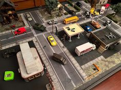 a model street with cars and trucks on it