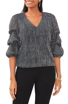 Shimmery threads lend a little glam to this lantern-sleeve top. V-neck Three-quarter sleeves 55% metallic fibers, 45% polyester Hand wash, line dry Imported