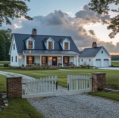 a large white house with a black roof