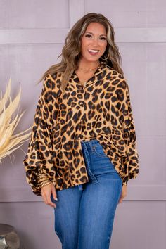 Crafted from luxurious satin material, this button-down blouse showcases a fierce leopard print. With long sleeves and a comfortable one size fit, this blouse effortlessly adds a touch of wild to any wardrobe. Show off your fashion savvy with this trendy and versatile top. Erin is wearing a one size One Size Fits Most 100% Polyester One Size Measurements Length: 24" Bust: 26" Washing Instructions Hand wash cold separately. Do not bleach. Hang to dry Trendy Long Sleeve Leopard Print Blouse, Chic Leopard Print Blouse For Fall, Oversized Leopard Print Tops With Long Sleeves, Fall Leopard Print Button-up Blouse, Cheetah Top, Walk On The Wild Side, Satin Material, Walk On, Washing Instructions