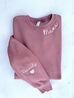 "Mauve Mama Sweatshirt with Kid's Names on the Sleeve is the perfect gift for Moms, Grandmas or Aunties!  Bella + Canvas sweatshirts are excellent quality and the stitching around the collar and on the sleeve comes out looking neat and crisp every time.  About the sweatshirt: *Bella + Canvas Sponge Fleece Drop Shoulder Crewneck Sweatshirt *Airlume combed and ringspun cotton/polyester fleece *52% cotton, 48% polyester  *Drop shoulder *UNISEX sizing - please note that these are not women's sizes; Gift Sweatshirt With Embroidered Text And Long Sleeves, Embroidered Logo Sweatshirt As A Gift, Long Sleeve Sweatshirt With Embroidered Logo Gift, Embroidered Logo Long Sleeve Sweatshirt, Gift Cotton Sweater With Custom Embroidery, Embroidered Relax Fit Sweatshirt For Gift, Custom Embroidered Cotton Sweater As Gift, Embroidered Relaxed Fit Sweatshirt For Gift, Embroidered Relaxed Fit Sweatshirt As Gift