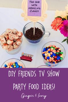 a table topped with lots of candy and candies next to a sign that says diy friends tv show party food ideas