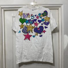 Vintage Glitter Paint Stars and Hearts Single Stitch T-shirt Brand is Anvil.  100% cotton.  Made in the USA.  Tag says size large.  The bust measures 21'' flat across armpit to armpit and the length from shoulder seam to bottom along the side is 28''. Stars And Hearts, Tshirt Painting, Puffy Paint, 80s Outfit, Glitter Paint, Shirt Brand, Gender Neutral, Bathing Beauties, Adult Outfits