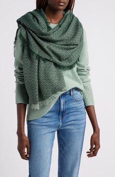 Warm up your cold-weather ensembles with this cozy scarf featuring a raw edge and woven herringbone pattern. 34" x 73"; 1/2" fringe 100% acrylic Machine wash, tumble dry Imported Casual Fringe Scarves For Winter, Green Casual Shawl For Fall, Casual Winter Scarves With Fringe, Casual Green Shawl For Fall, Cozy Fringed Scarves For Fall, Cozy Wool Scarves For Fall, Casual Wool Scarves For Fall, Casual Cotton Scarves For Fall, Casual Green Winter Shawl