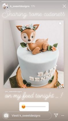 the cake is decorated with an image of a baby deer on it's side