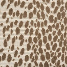 an animal print fabric with brown spots on it