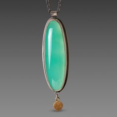 This necklace features a luminous, smooth chrysoprase wrapped in 22k gold and accented with a single hammered 22k gold disk. Oxidized sterling silver chain. Pendant, including drop, measures approximately 1/2 inch x 1 3/4 inches. Matte finish. Chrysoprase Necklace, Bling Ideas, Silver Chain Pendant, Petrified Wood, Oxidized Sterling Silver, Chain Pendant, 22k Gold, Sterling Silver Chain, Making Jewelry