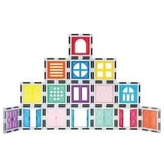 a colorful building made out of blocks with doors and windows on each side, in front of a white background