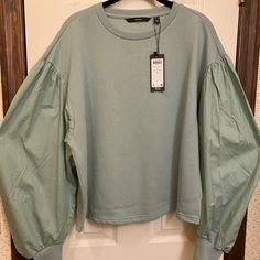 Vero Moda Balloon-Sleeve Top. Size Xl. Celadon Green New With Tag. Top 65%Polyester/35%Cotton With Sleeves 109%Cotton. Green Balloon Sleeve Fall Top, Fall Cotton Top With Balloon Sleeves, Fall Cotton Tops With Balloon Sleeves, Cotton Balloon Sleeve Top For Fall, Green Tops With Blouson Sleeves For Fall, Casual Oversized Puff Sleeve Tops, Casual Balloon Sleeve Relaxed Fit Tops, Casual Relaxed Fit Balloon Sleeve Tops, Casual Fall Tops With Balloon Sleeves