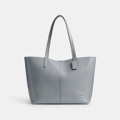 Going places? Take our practical-yet-polished North along for the ride. Crafted of soft leather that’s tumbled for a luxurious feel and glazed for a high-shine finish this snap-closure Tote 32 is finished with an inside zip pocket and our Signature hardware. With space for a 13” laptop it’s a minimalist sophisticated style that’s great for work (and play). | Coach North Tote 32 - Women's - Silver/grey Blue Modern Coach Shoulder Bag With Zipper Pocket, Modern Coach Shoulder Bag For Shopping, Modern Coach Bag With Zipper Pocket, Coach Satchel With Zipper Pocket For Everyday, Modern Coach Bag, Coach Leather Bags With Large Capacity, Coach Shoulder Bag With Zipper Pocket For Shopping, Coach Tote Bag With Zipper Pocket, Coach Bags With Zipper Pocket For Shopping