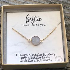 a necklace in a box with the message bestie because of you, i laugh a little louder cry a little less and smile a lot more