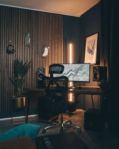 a desk with speakers and a computer on it