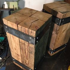 two wooden boxes sitting next to each other on top of a table in a room