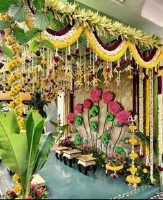 an outdoor stage decorated with flowers and greenery for a wedding or special function event