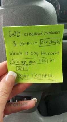 someone is holding up a green piece of paper that says god created heaven and earth in six days