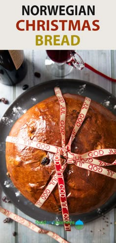 a loaf of bread wrapped in tape on top of a plate with the words norwegian christmas bread