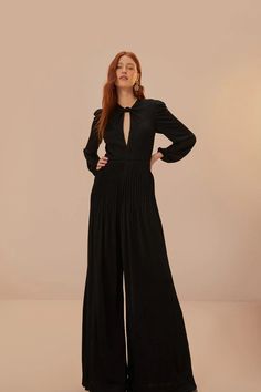 Black Long Sleeve Knot Jumpsuit – FARM Rio Chic V-neck Jumpsuits And Rompers For Gala, Elegant V-neck Cocktail Jumpsuits And Rompers, Elegant Maxi Jumpsuits And Rompers For Night Out, Elegant Solid Pantsuit For Night Out, Elegant Maxi Length Jumpsuits For Night Out, Elegant Solid Color Pantsuit For Night Out, Elegant Solid Color Pantsuit For Date Night, Chic Pleated Jumpsuits And Rompers For Evening, Chic Maxi Length Jumpsuits And Rompers