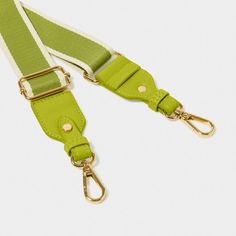 Our Stripe Canvas Bag Strap in Lime Green showcases a lightweight canvas material adorned with soft vegan leather trim. The addition of Katie Loxton branded hardware adds a premium flair, while the adjustable design ensures both comfort and style. Wear over the shoulder or as a convenient hands-free crossbody, getting you from A to B effortlessly. Katie Loxton, Soft Bag, Bag Straps, Leather Trim, Canvas Bag, Canvas Material, Hands Free, Leather Trims, Lime Green