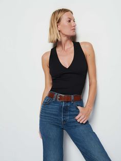 A familiar cut (without any of the fuss). It's a sleeveless tank with a halter-style front you love. (This one comes in Jet Black.) | Women's Leticia Tank Top in Jet Black | Ethical Essentials Spring Racerback Tank Top For Night Out, Chic Racerback Top With Built-in Bra, Chic Fitted Racerback Halter Top, Racerback Top With Built-in Bra For Night Out, Versatile Tank Top With Built-in Bra For Night Out, Stretch Tank Top With Built-in Bra For Date Night, Sleeveless Halter Top For Everyday Spring Wear, Spring Sleeveless Halter Top For Everyday, Everyday Sleeveless Halter Top For Spring