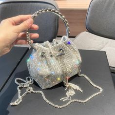 The hottest bucket bag we ever saw. Available in silver or gold. Designer Purses And Handbags, Crystal Handbag, Bucket Purse, Crystal Clutch, Clutch Purse Evening, Designer Shoulder Bags, Purses Designer, Evening Clutch Bag, Evening Clutch