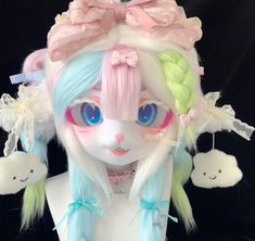 a doll with pastel hair and blue eyes