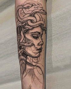 a woman's face with snakes on her arm and the other part of her head