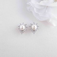 Pearl Clip-On Stud Earrings for Brides and Women If you’re looking for an ideal blend of elegance and sparkle, these pearl stud clip-on earrings are a great choice and are designed for brides and women seeking refined accessories for weddings and special occasions. The clip on earrings feature marquise cubic zirconia crystals with a white pearl in silver tone. The clip-on stud earrings are lightweight and comfortable, making them perfect for long hours of wedding celebrations. Whether on your we White Clip-on Pearl Earrings For Wedding, White Gold Clip-on Pearl Earrings For Evening, Pearl White Pearl Clip-on Earrings For Wedding, Evening White Gold Clip-on Pearl Earrings, White Pearl Clip-on Earrings For Party, Poetry Design, Bridal Event, Long Hours, Matching Jewelry