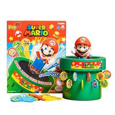 the super mario toy is next to its box