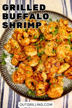 grilled buffalo shrimp on a plate with parsley garnish and text overlay