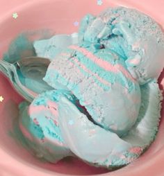 two scoops of ice cream in a pink bowl