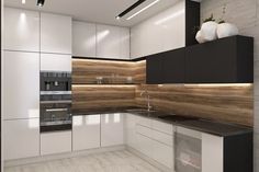 a modern kitchen with white cabinets and black counter tops, wood paneling on the wall