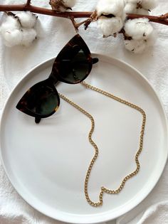 A Gold Sunglasses Chain in a unique design that is made from stainless steel and fits in all glasses designs. You can select between three available lengths. MATERIALS - Chain is made from Stainlees Steel in Gold Color. DIMENSIONS - You can choose in three different dimensions for your glasses. - 70 cm - 80 cm - 90 cm PROTECTION - Protect them from water, parfumes, hair and body lotion to keep them bright and shiny for years. # FIND ALL MY DESIGNS IN GLASSES CHAINS HERE: https://etsy.me/2W1xaRS Modern Metal Glasses Chains With Adjustable Chain, Modern Glass Sunglasses As Gift, Gold Chain Glasses Chains Made Of Glass For Gift, Metal Glasses Chains As Gift, Adjustable Gold Glass Chain For Glasses, Gold Chain Glasses Chain As Gift, Gold Chain Glasses Chains For Gifts, Adjustable Glass Sunglasses As Gift, Trendy Metal Glasses Chains With Gold Chain