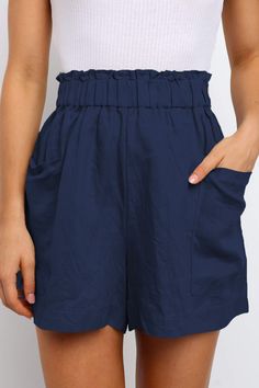 Blue Paperbag Waist Flare Casual Shorts with Pockets Blue Solid Color Shorts For Vacation, Blue Shorts For Vacation, Summer Blue Solid Color Bottoms, Solid Blue Summer Bottoms, Blue Solid Color Summer Bottoms, Blue Paperbag Waist Bottoms For Spring, Blue Cotton Paperbag Waist Shorts, Blue Cotton Shorts With Paperbag Waist, Blue Shorts With Side Pockets For Summer