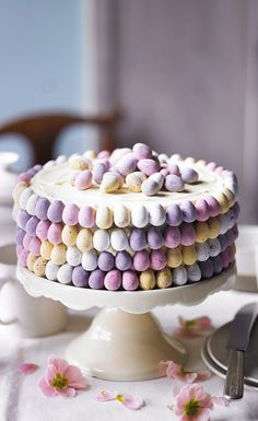 a cake with marshmallows on it sitting on a table