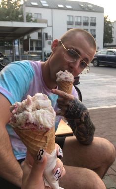 a man is eating an ice cream cone