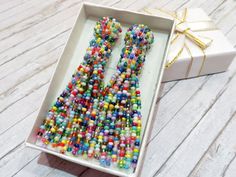 Colorful beaded tassel earrings Multicolor clip on earrings | Etsy Multicolor Beaded Tassel Earrings For Party, Multicolor Beaded Drop Clip-on Earrings, Beaded Tassel Earrings With Round Beads For Parties, Party Tassel Earrings With Round Beads, Multicolor Beaded Clip-on Earrings For Parties, Multicolor Beaded Clip-on Drop Earrings, Beaded Dangle Clip-on Earrings Gift, Colorful Beaded Tassel Drop Earrings As Gift, Colorful Beaded Round Clip-on Earrings For Gift