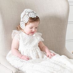 Handmade in the USA Our newest stunning design, the Poppy Christening gown is a gorgeous full-length heirloom gown that is sure to impress on your baby girls Blessing day. It is already a customer favorite and it's easy to see why. This beautiful Baptism gown is lined with rich silk dupioni in a shade of ivory. The subdued silk color is the perfect shade to enhance the intricate floral lace that lays upon it. The same gorgeous lace is continued on the adorable cap sleeves, with lace scallops add Princess Gown With Fitted Bodice For Baptism, Blessing Gown, Baptism Gown, Silk Dupioni, Clothes Stand, Christening Gown, Heirloom Gifts, Girl Christening