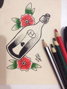 a drawing of a bottle with flowers on it next to colored pencils and markers