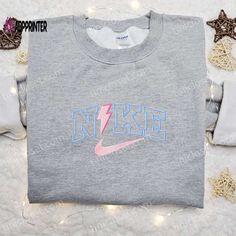 The Thunder x Nike Embroidered Sweatshirt is a perfect blend of style and comfort. Made with premium quality fabric, it features intricate Thunder and Nike embroidery, adding a unique touch to your wardrobe. With its relaxed fit and cozy feel, this sweatshirt is perfect for everyday wear or lounging around. The Thunder x Nike Embroidered Sweatshirt not only offers a trendy and fashionable look, but also provides utmost comfort, making it a must-have for any fashion enthusiast. Upgrade your wardr Nike Cartoon, Disney Character Shirts, Nike Inspired, Best Family Gifts, Maroon Hoodie, Embroidered Shirts, Mike Wazowski, Best Valentine's Day Gifts, Heart Embroidery