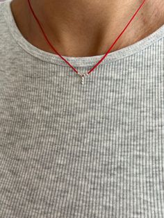 This handmade necklace features a striking combination of red cord, silver beads, and a single charm. The vibrant red cord serves as a bold base, contrasting beautifully with the elegant silver beads that add a touch of sophistication. The charm, carefully selected for its unique design, completes the piece, making it a standout accessory. Ideal for adding a pop of color and style to any outfit, this necklace is perfect for both casual and formal occasions. Its handcrafted nature ensures each pi Red String Necklace, Wish Necklace, Ear Cuff Jewelry, String Necklace, Minimal Necklace, Red String, Leather Corded Necklace, Cuff Jewelry, Protection Necklace