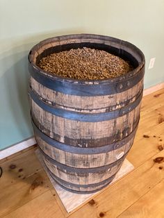 Repurposed Whiskey Barrel for pellet storage. Holds approximately 7-8 40lb bags. Pellet Stove Decorating Ideas, Pellet Stove Storage Ideas, Indoor Pellet Storage, Pellet Stove Pellet Storage Ideas, Pellet Storage Ideas Living Rooms, Pellet Stove Decor, Pellet Stove Basement, Basement Pellet Stove Ideas, Smoker Pellet Storage Ideas