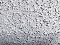 the texture of an old cement wall is white