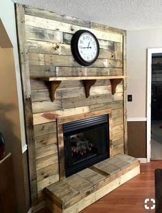 a clock mounted on the wall above a fireplace