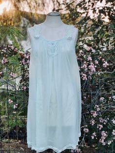 Elevate your vintage lingerie collection with this Vintage Mint Green Slip Dress, a charming pastel mint green teddy nightgown with an alluring design. This slip dress features delicate lace trim and shoulder straps, adding a touch of elegance to your sleepwear. While it may have a small hole in the fabric (barely noticeable), it doesn't detract from its overall beauty. Key Features: Vintage Charm: This slip dress captures the charm of pastel mint green lingerie from yesteryears. Lace Trim: Deli Green Summer Nightgown For Sleepover, Green Sleeveless Nightgown For Loungewear, Green Sheer Summer Sleepwear, Green Spring Nightgown For Loungewear, Green Sleeveless Summer Nightgown, Sheer Green Sleepwear For Summer, Green Sheer Sleeveless Sleepwear, Sheer Sleeveless Green Sleepwear, Green Summer Nightgown For Sleep