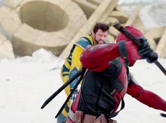 a man dressed as deadpool in the snow